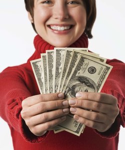 Happy woman holding money