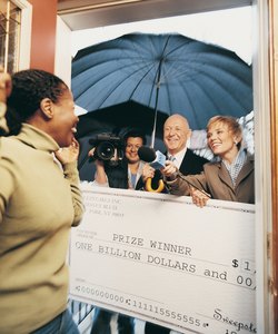 Broadcasters Present a Cheque to an Ecstatic Woman in her Home