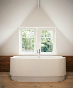 Bathtub by window