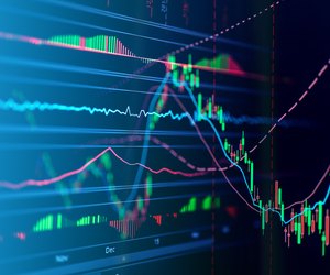 Close-Up Of Stock Market Data On Digital Display