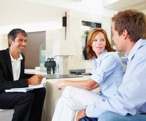 Couple discussing investment plans with consultant