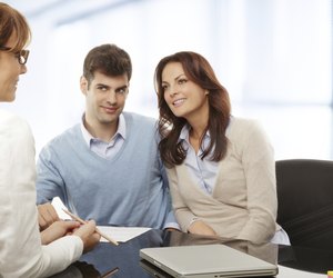 Young couple discussing financial plan with consultat