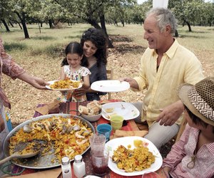 family eating paella outdoors