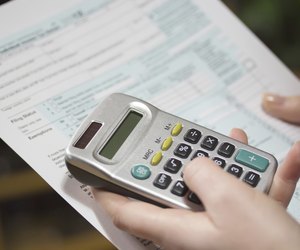 Filling income tax forms with calculator