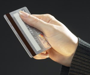 Woman holding a credit card