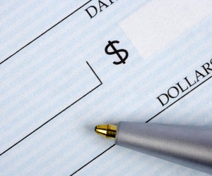 Closeup of check with pen