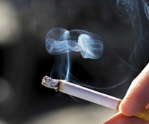 Holding a cigarette