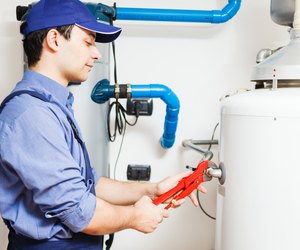Technician repairing an hot-water heater
