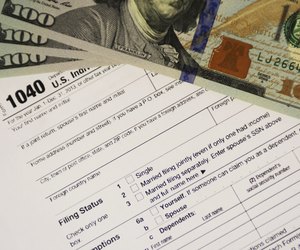 IRS Tax Form 1040 with Money