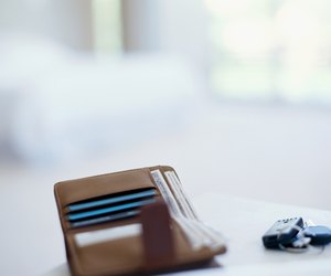 close-up of a wallet and car keys