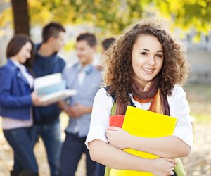 Cheerful young student smiling