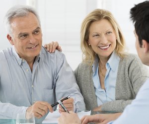 Senior Couple Talking With A Consultant