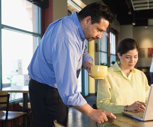 Multi-ethnic businesspeople working at cafe
