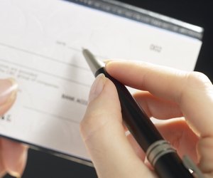 Woman writing a check