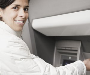 Young woman using an ATM