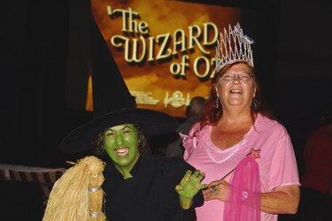 Two women dressed as the Wicked Witch of the West and Glinda the Good Witch
