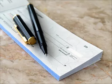 How to Tell if a Check is Fake                             Cheque with Pen