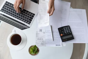 Above top view close up young woman managing taxes