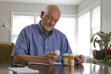 Older man with prescription medications