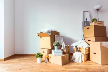 Move. Cardboard boxes and cleaning things for moving into a new home