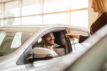 Salesperson working at car dealership