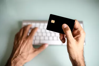 A man using credit card, online shopping / electronic banking