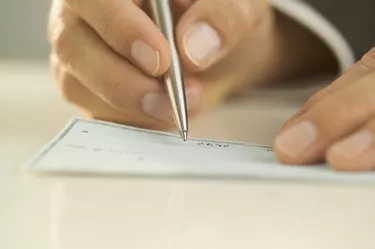 Man writing out a check