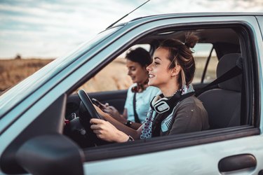 Twin sister having a road trip on a sunny summer day