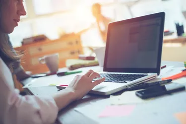 Woman manager working with project on laptop