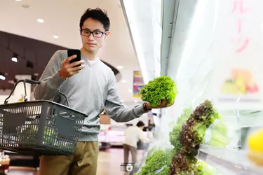 Mid adult male buying grocery in supermarket