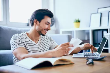 Happy man paying taxes