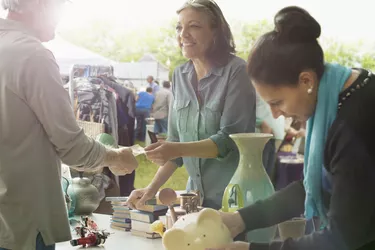 Hispanic women shopping at flea market