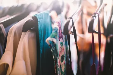 Close-up of coathangers with dresses