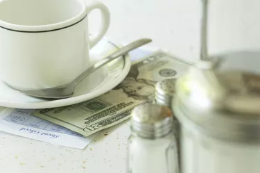 What Is the Tax on Restaurant Food in Illinois? Empty coffee cup and payment