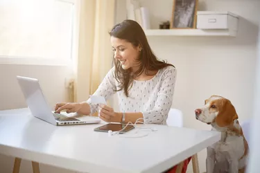 Young Caucasian businesswoman doing on on line payment