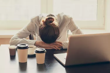 Tired woman in the office