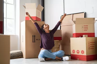 Excited young woman in new apartment