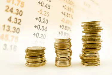 rows of coins on display of Stock market