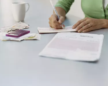 Woman Writing a Cheque