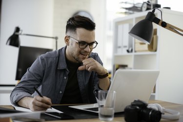 Young businessman working in office.