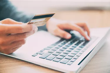 Man making online purchase with credit card