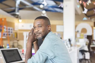 Businessman using laptop in office