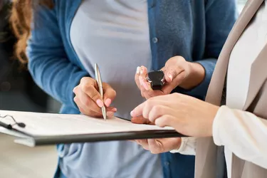 New Car Owner Signing Contract