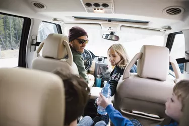 Family on road trip, riding in SUV