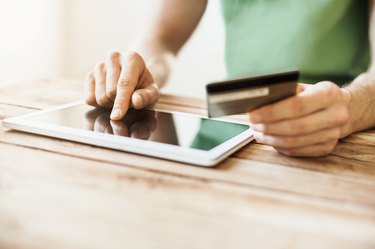 How to Enter a Credit Card Number                Man is shopping online