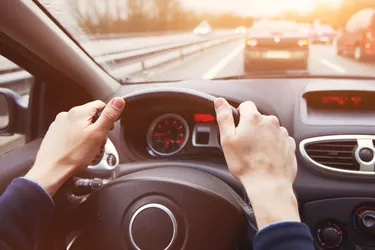 traffic jam, driving car on highway, close up of hands