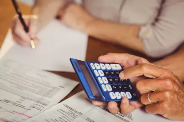 Senior couple counting bills