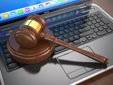 How To Check a Bankruptcy Status OnlineOnline internet auction. Gavel on laptop.