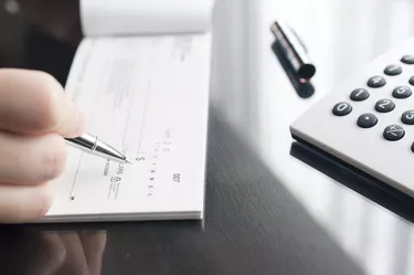 Business woman prepare writing a check