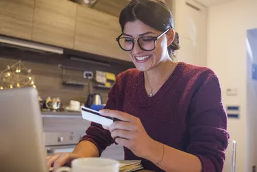 beautiful young woman shopping online from home